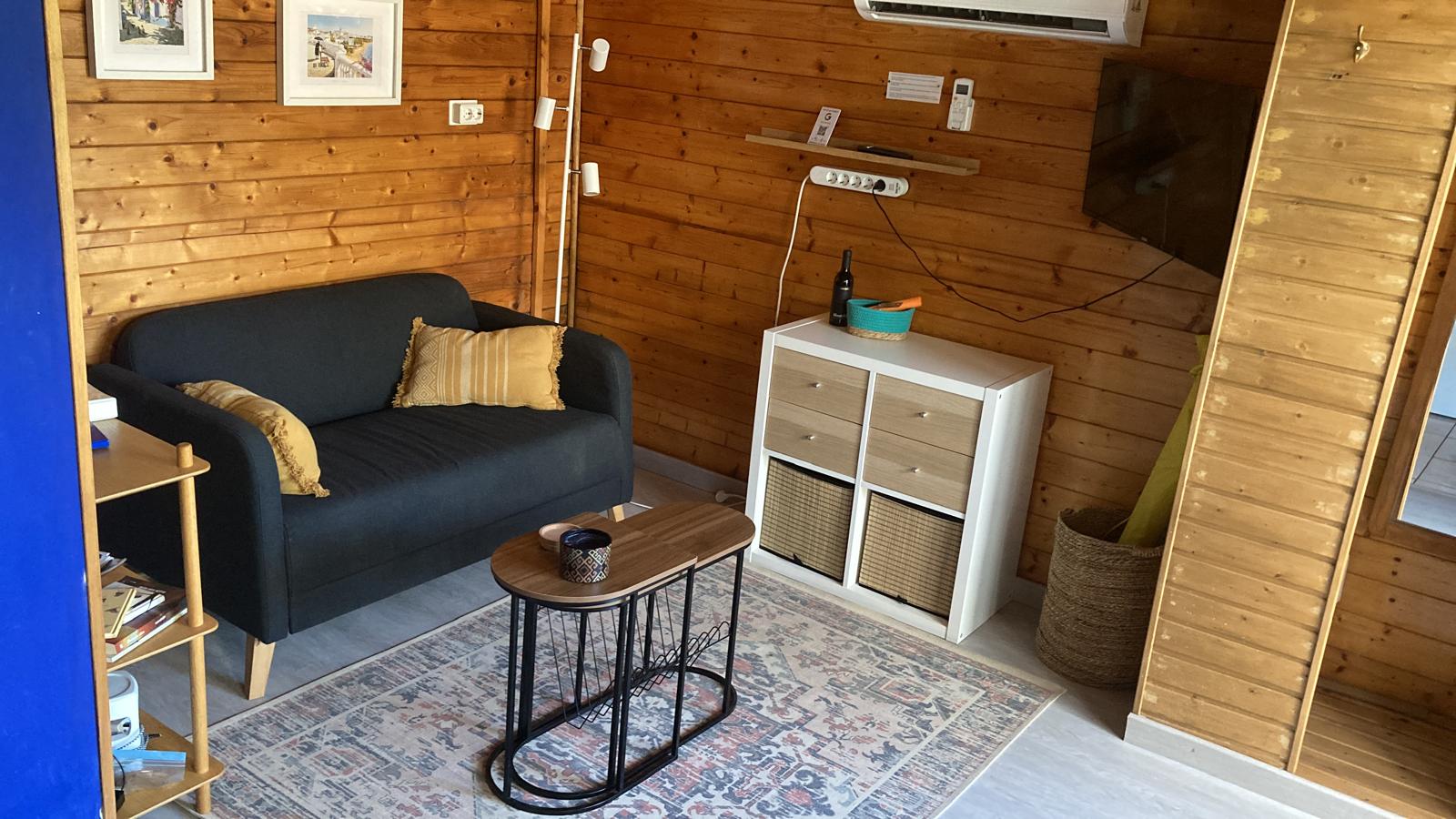 La Casita living room with the white KALLAX storage unit, drawers and baskets added after a guest suggestion