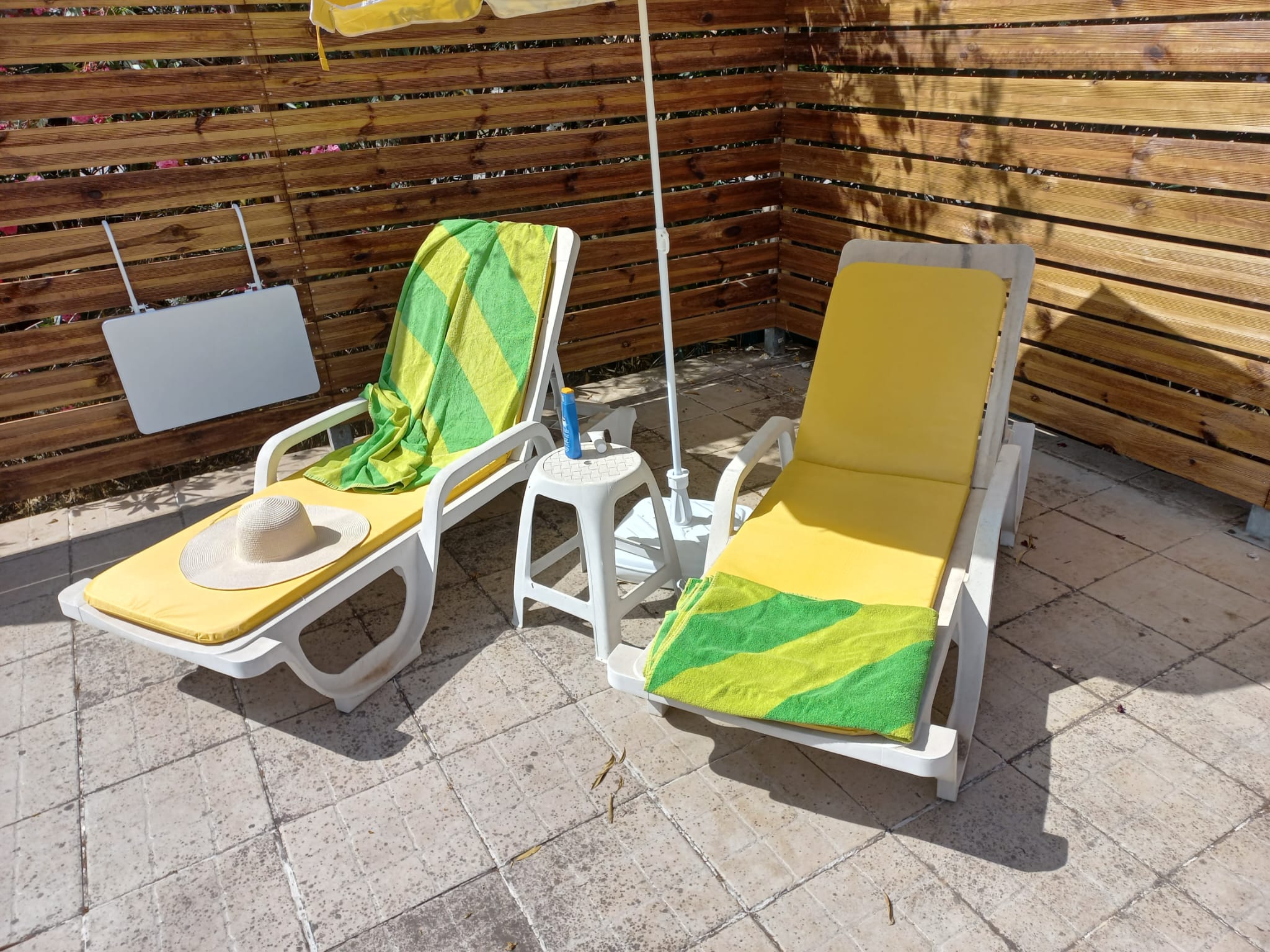 Two sun loungers on the terrace at La Casita