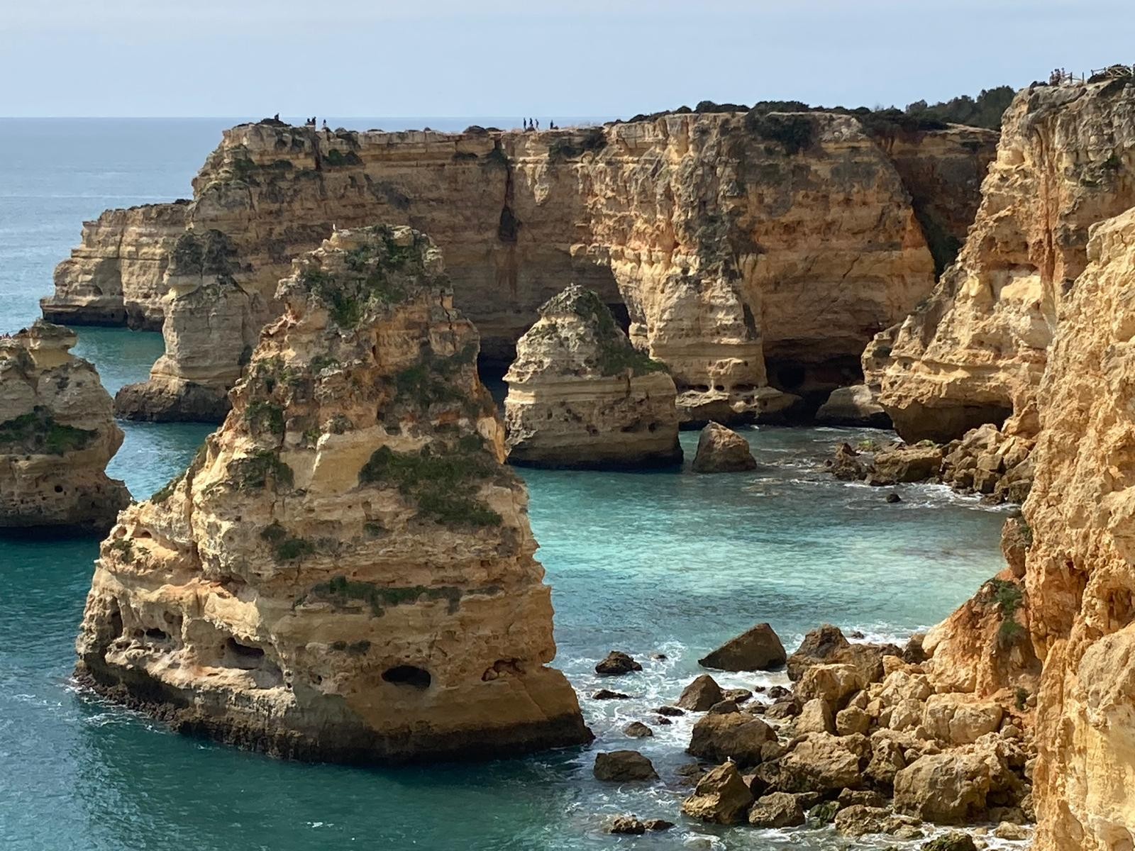 Limestone sea stacks and turquoise water at Praia da Marinha