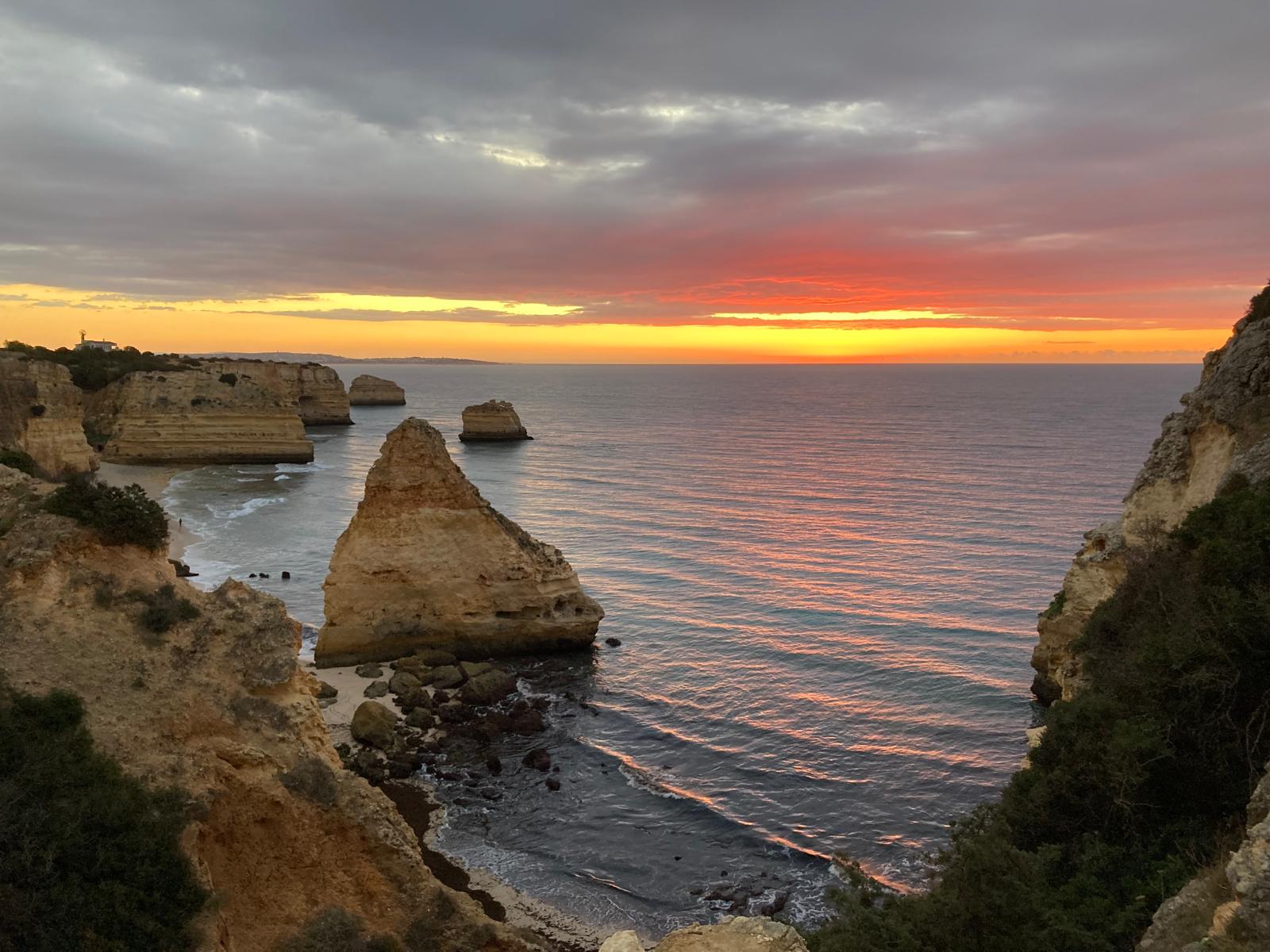 Cliffs and sea near Praia da Marinha at sunrise