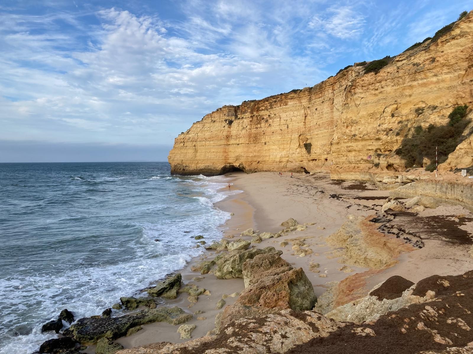 Vale Centeanes beach below the golden limestone cliffs